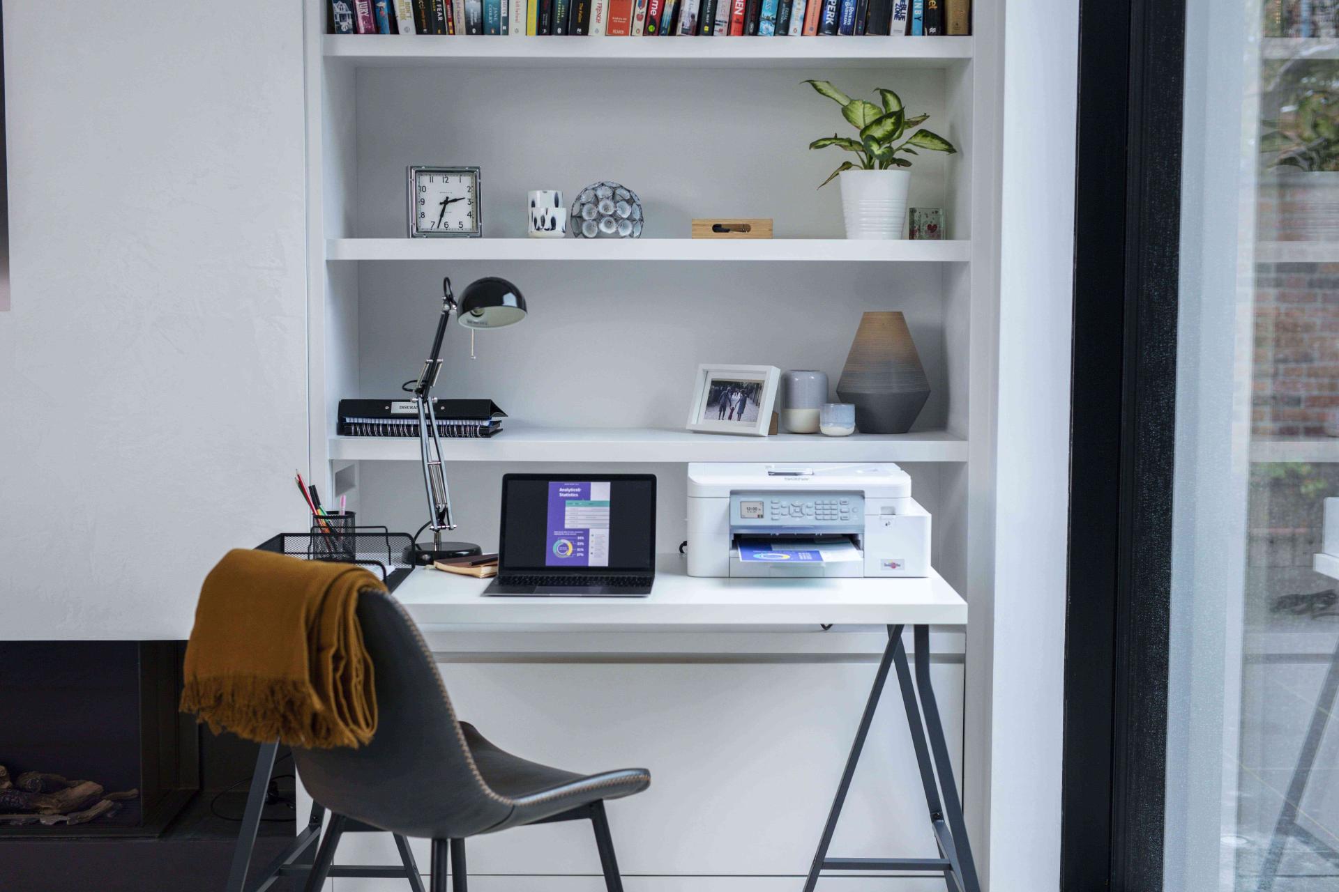 An office space with a MFC-J4340DW device on the table.